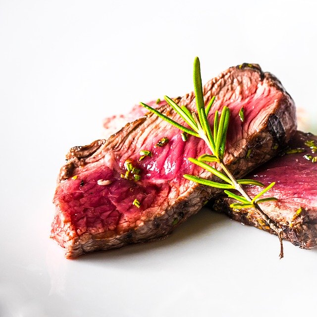 Two slices of Tataki beef with some spices