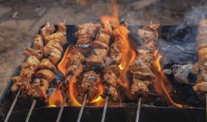 meat grilled outside on a skewers