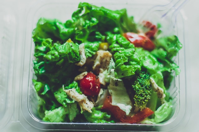 Bowl of fresh salad with some slices of chicken